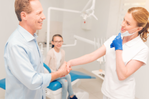 a parent and child visiting the dentist